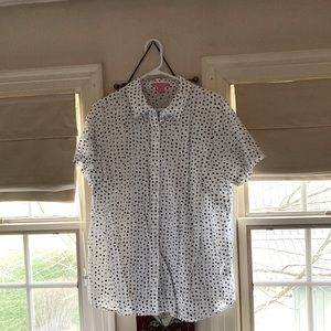 White blouse with black/gray polka dots.